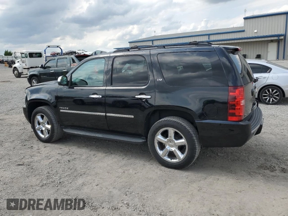 2014 Chevrolet Tahoe LTZ with VIN 1GNSKCE0XER228028, listed as a Copart auction lot 56971135 with 155,285 mi miles and Salvage title. Bid and sale history available at DreamBid. Image 2.