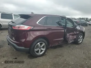 2019 Ford Edge SEL with VIN 2FMPK4J92KBB34891, listed as a Copart auction lot 60050945 with 104,942 mi miles and Salvage title. Bid and sale history available at DreamBid. Image 3.