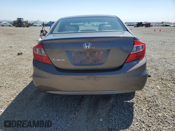 2012 Honda Civic LX z VIN 2HGFB2F5XCH517276, wystawiony jako Copart lot #59443775 z przebiegiem 98 749 mil mil oraz Szkoda całkowita • Salvage title. Historia ofert i sprzedaży dostępna na DreamBid. Obrazek 6.
