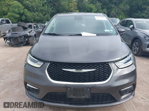 2023 Chrysler Pacifica Touring L with VIN 2C4RC1BG8PR594481, listed as a IAAI auction lot 42618839 with 60,748 mi miles and . Bid and sale history available at DreamBid. Image 12.