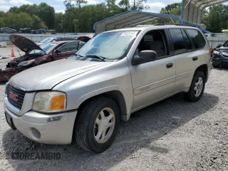 2004 GMC Envoy SLE with VIN 1GKDS13S942119615, listed as a Copart auction lot 69653494 with 141,856 mi miles and Salvage Title. Bid and sale history available at carsss.com. Image 1.