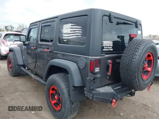 2014 Jeep Wrangler Unlimited Sport with VIN 1C4BJWDG6EL239378, listed as a IAAI auction lot 42073392 with 120,999 mi miles. Bid and sale history available at carsss.com. Image 3.
