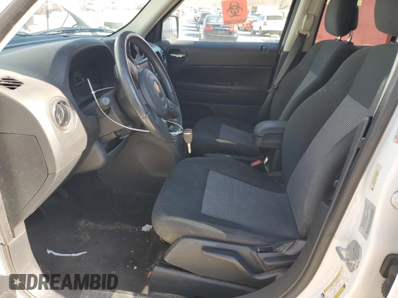 2015 Jeep Patriot High Altitude with VIN 1C4NJRFB5FD169156, listed as a Copart auction lot 50393335 with 122,233 mi miles and Salvage title. Bid and sale history available at DreamBid. Image 7.