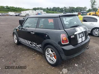 2009 MINI Hardtop with VIN WMWMF33539TW76329, listed as a IAAI auction lot 42512079 with 94,865 mi miles and . Bid and sale history available at DreamBid. Image 3.