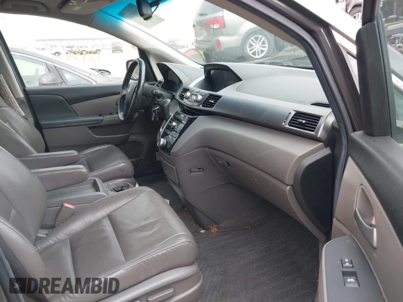 2012 Honda Odyssey EX-L with VIN 5FNRL5H60CB081866, listed as a IAAI auction lot 41835701 with 151,236 mi miles and . Bid and sale history available at DreamBid. Image 5.
