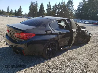 2018 BMW M5 z VIN WBSJF0C57JB283361, wystawiony jako Copart lot #65352164 z przebiegiem Nie podano mil oraz Szkoda całkowita • Salvage title. Historia ofert i sprzedaży dostępna na DreamBid. Obrazek 3.