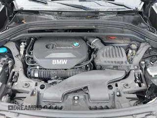 2018 BMW X1 xDrive28i with VIN WBXHT3C34J5K31430, listed as a IAAI auction lot 41954792 with 125,447 mi miles. Bid and sale history available at carsss.com. Image 10.