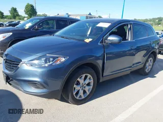 2015 Mazda CX-9 Sport z VIN JM3TB2BAXF0465720, wystawiony jako IAAI lot #42305436 z przebiegiem 130 543 mil mil oraz . Historia ofert i sprzedaży dostępna na DreamBid. Obrazek 18.