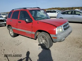 2004 Chevrolet Tracker with VIN 2CNBJ134846911647, listed as a Copart auction lot 77128924 with Not provided miles and Salvage title. Bid and sale history available at DreamBid. Image 4.