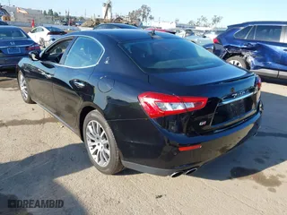2014 Maserati Ghibli S Q4 with VIN ZAM57RTA2E1086046, listed as a IAAI auction lot 41846389 with 55,984 mi miles. Bid and sale history available at carsss.com. Image 3.