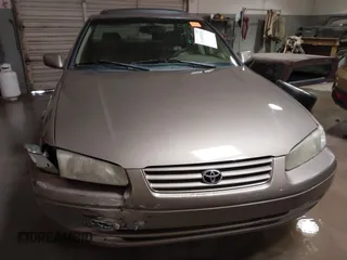 1999 Toyota Camry LE z VIN JT2BF28K7X0167855, wystawiony jako IAAI lot #41609230 z przebiegiem 242 398 mil mil oraz . Historia ofert i sprzedaży dostępna na DreamBid. Obrazek 12.