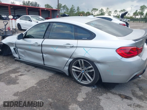 2018 BMW 4 Series 440i with VIN WBA4J5C57JBF07227, listed as a IAAI auction lot 41562986 with 76,316 mi miles and . Bid and sale history available at DreamBid. Image 6.