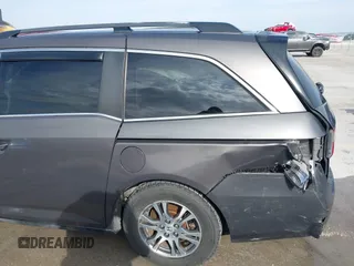 2012 Honda Odyssey EX-L with VIN 5FNRL5H60CB094682, listed as a IAAI auction lot 41570797 with 127,890 mi miles and . Bid and sale history available at carsss.com. Image 18.