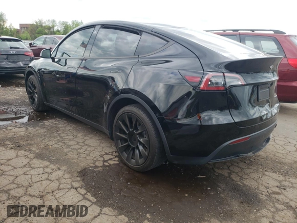 2022 Tesla Model Y Long Range z VIN 7SAYGDEEXNA008898, wystawiony jako Copart lot #54915445 z przebiegiem 35 467 mil mil oraz Szkoda całkowita • Salvage title. Historia ofert i sprzedaży dostępna na DreamBid. Obrazek 2.