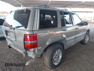 1998 Jeep Grand Cherokee Laredo with VIN 1J4GZ58S9WC136684, listed as a IAAI auction lot 41444103 with 1 mi miles. Bid and sale history available at carsss.com. Image 4.