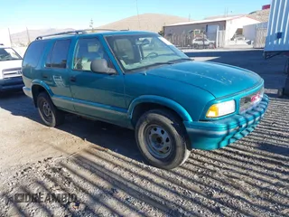 1996 GMC Jimmy SL with VIN 1GKDT13W6T2505181, listed as a IAAI auction lot 41392669 with 213,728 mi miles. Bid and sale history available at carsss.com. Image 1.