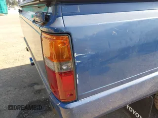 1987 Toyota Pickup with VIN JT4RN50RXH0283460, listed as a IAAI auction lot 42086809 with 183,562 mi miles and . Bid and sale history available at DreamBid. Image 14.