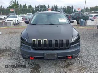 2014 Jeep Cherokee Trailhawk z VIN 1C4PJMBB1EW145683, wystawiony jako IAAI lot #42487730 z przebiegiem 148 277 mil mil oraz . Historia ofert i sprzedaży dostępna na DreamBid. Obrazek 13.