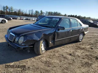 1996 Mercedes-Benz E Class with VIN WDBJF20F5TJ021801, listed as a Copart auction lot 80188074 with 196,397 mi miles and Salvage Title. Bid and sale history available at carsss.com. Image 1.