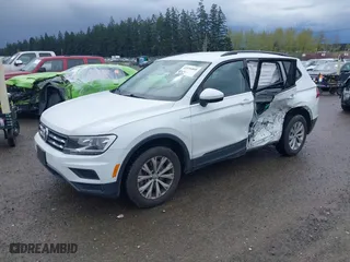 2018 Volkswagen Tiguan S with VIN 3VV0B7AXXJM051617, listed as a IAAI auction lot 41976860 with 66,186 mi miles. Bid and sale history available at carsss.com. Image 2.