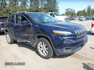 2015 Jeep Cherokee Latitude with VIN 1C4PJMCB0FW702535, listed as a IAAI auction lot 42149898 with 125,938 mi miles and . Bid and sale history available at carsss.com. Image 1.