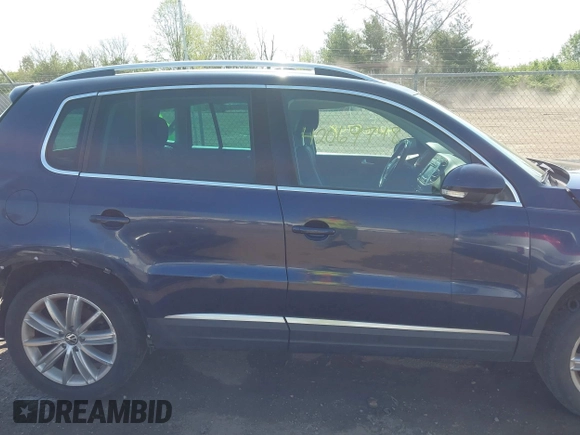 2012 Volkswagen Tiguan S with VIN WVGBV7AX2CW566981, listed as a IAAI auction lot 42069748 with 153,613 mi miles and . Bid and sale history available at DreamBid. Image 14.