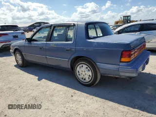 1993 Dodge Spirit z VIN 1B3XA46K0PF638477, wystawiony jako Copart lot #75710534 z przebiegiem 50 637 mil mil oraz Szkody całkowita. Historia ofert i sprzedaży dostępna na DreamBid. Obrazek 2.