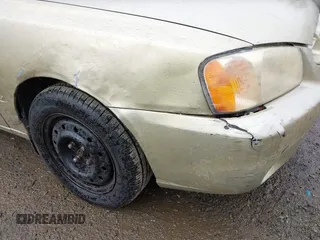 2002 Hyundai Accent GL with VIN KMHCG35CX2U199532, listed as a IAAI auction lot 41839270 with 200,232 mi miles. Bid and sale history available at carsss.com. Image 6.