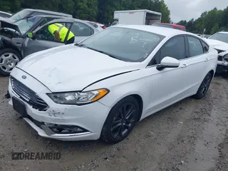 2018 Ford Fusion SE with VIN 3FA6P0HD6JR153230, listed as a IAAI auction lot 40336904 with 71,949 mi miles and . Bid and sale history available at DreamBid. Image 2.