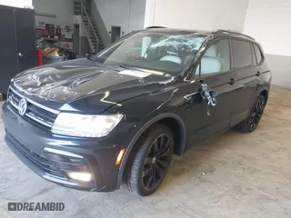 2021 Volkswagen Tiguan SE with VIN 3VV2B7AX1MM012587, listed as a IAAI auction lot 41653479 with 28,158 mi miles. Bid and sale history available at carsss.com. Image 2.