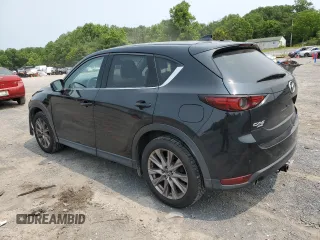 2019 Mazda CX-5 Grand Touring with VIN JM3KFBDM2K0569829, listed as a Copart auction lot 59060965 with 99,359 mi miles and Salvage title. Bid and sale history available at DreamBid. Image 2.