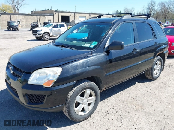 2010 Kia Sportage LX with VIN KNDKGCA34A7669279, listed as a IAAI auction lot 42132770 with 142,828 mi miles and . Bid and sale history available at carsss.com. Image 2.