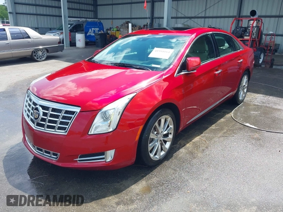 2013 Cadillac XTS Premium with VIN 2G61S5S34D9237236, listed as a IAAI auction lot 41994164 with 218,719 mi miles. Bid and sale history available at carsss.com. Image 2.