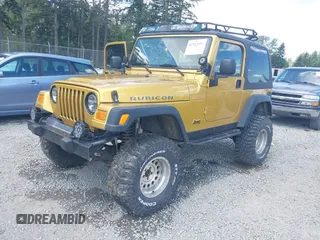 2003 Jeep Wrangler Rubicon with VIN 1J4FA69S93P302102, listed as a IAAI auction lot 42312951 with 146,408 mi miles and . Bid and sale history available at DreamBid. Image 2.