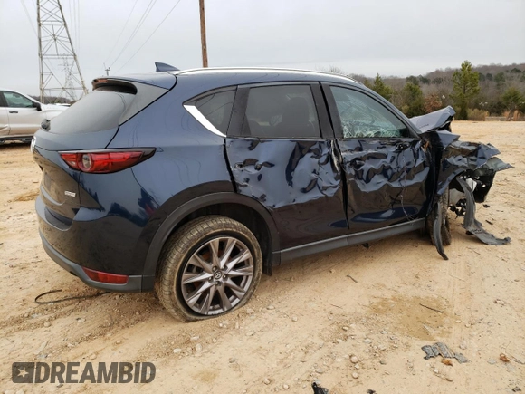 2019 Mazda CX-5 Grand Touring with VIN JM3KFADM0K1596256, listed as a Copart auction lot 86323594 with 118,853 mi miles and Salvage title. Bid and sale history available at DreamBid. Image 3.