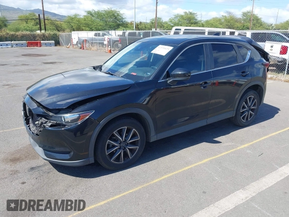2018 Mazda CX-5 Touring z VIN JM3KFACM5J0309533, wystawiony jako IAAI lot #42195429 z przebiegiem 91 928 mil mil oraz . Historia ofert i sprzedaży dostępna na DreamBid. Obrazek 2.