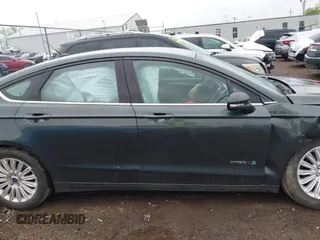 2015 Ford Fusion SE Hybrid with VIN 3FA6P0LU9FR184907, listed as a IAAI auction lot 42119737 with 153,255 mi miles and . Bid and sale history available at DreamBid. Image 14.