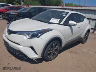 2019 Toyota C-HR XLE with VIN JTNKHMBX7K1023674, listed as a IAAI auction lot 42021152 with 106,450 mi miles. Bid and sale history available at carsss.com. Image 2.