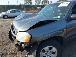 2004 Mazda Tribute LX with VIN 4F2CZ941X4KM19302, listed as a IAAI auction lot 41791389 with 123,036 mi miles. Bid and sale history available at carsss.com. Image 13.