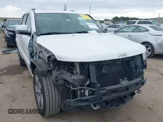 2014 Jeep Grand Cherokee Overland with VIN 1C4RJECG3EC266659, listed as a IAAI auction lot 41363419 with 142,896 mi miles. Bid and sale history available at carsss.com. Image 1.