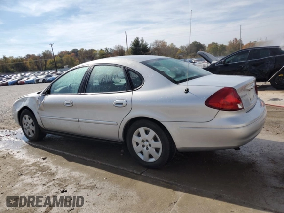 2003 Ford Taurus LX Standard z VIN 1FAFP52U93A159333, wystawiony jako Copart lot #78080944 z przebiegiem 54 652 mil mil oraz Szkoda całkowita • Salvage title. Historia ofert i sprzedaży dostępna na DreamBid. Obrazek 2.