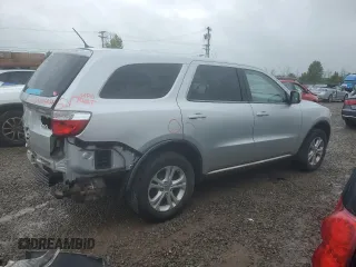 2012 Dodge Durango SXT with VIN 1C4RDJAG4CC106273, listed as a Copart auction lot 59767205 with 223,098 mi miles and Salvage title. Bid and sale history available at DreamBid. Image 3.