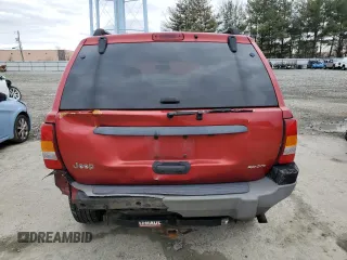 2002 Jeep Grand Cherokee with VIN 1J8GX38S92C176329, listed as a Copart auction lot 47885635 with 154,167 mi miles and Salvage title. Bid and sale history available at DreamBid. Image 6.