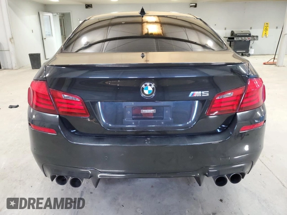 2013 BMW M5 z VIN WBSFV9C5XDC772672, wystawiony jako Copart lot #53732175 z przebiegiem 83 665 mil mil oraz Tytuł czysty. Historia ofert i sprzedaży dostępna na DreamBid. Obrazek 6.