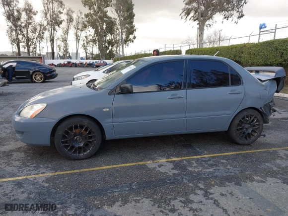 2004 Mitsubishi Lancer ES with VIN JA3AJ26E54U054570, listed as a IAAI auction lot 41592397 with 220,140 mi miles. Bid and sale history available at carsss.com. Image 14.