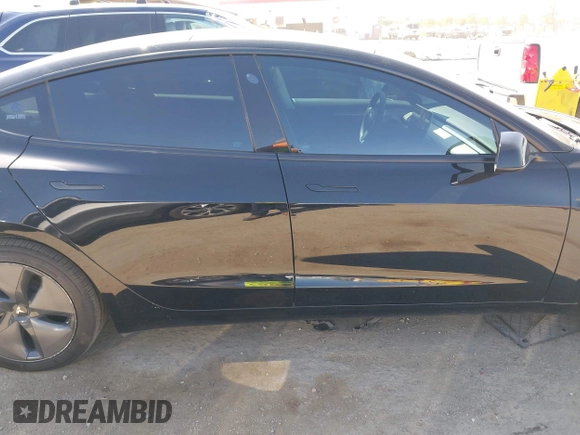 2021 Tesla Model 3 Long Range with VIN 5YJ3E1EB2MF065583, listed as a IAAI auction lot 42067399 with 52,333 mi miles. Bid and sale history available at carsss.com. Image 14.