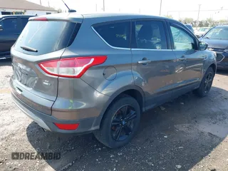 2013 Ford Escape SE with VIN 1FMCU9GX0DUA52263, listed as a IAAI auction lot 42211395 with 140,067 mi miles and . Bid and sale history available at DreamBid. Image 4.