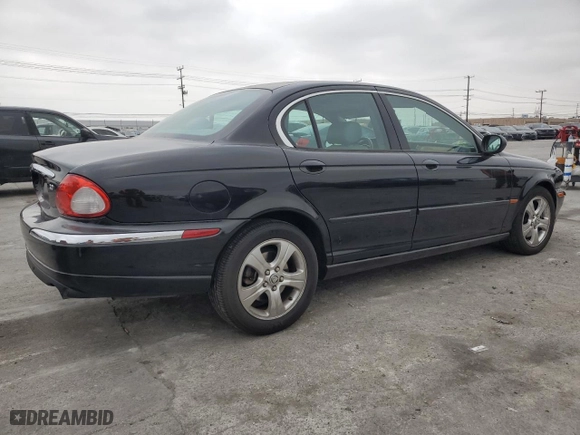 2002 Jaguar X-Type with VIN SAJEA51C02WC46124, listed as a Copart auction lot 50656395 with 50,815 mi miles and Salvage Title. Bid and sale history available at carsss.com. Image 3.