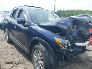 2016 Mazda CX-5 Touring z VIN JM3KE2CY0G0890329, wystawiony jako IAAI lot #39285716 z przebiegiem Nie podano mil oraz . Historia ofert i sprzedaży dostępna na DreamBid. Obrazek 1.