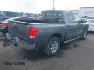 2014 Nissan Titan Pro-4X with VIN 1N6BA0EC3EN514358, listed as a IAAI auction lot 41636363 with 166,201 mi miles and . Bid and sale history available at DreamBid. Image 4.